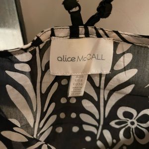 Light cotton material, falls nicely over a pair of jeans